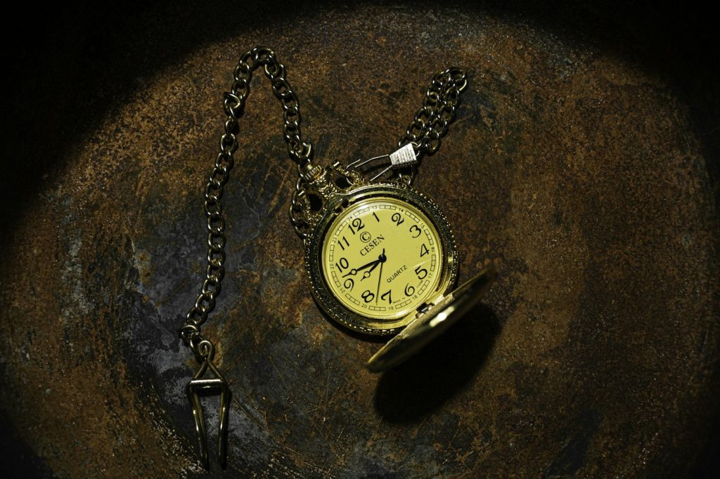 Gold-tone pocket watch and chain