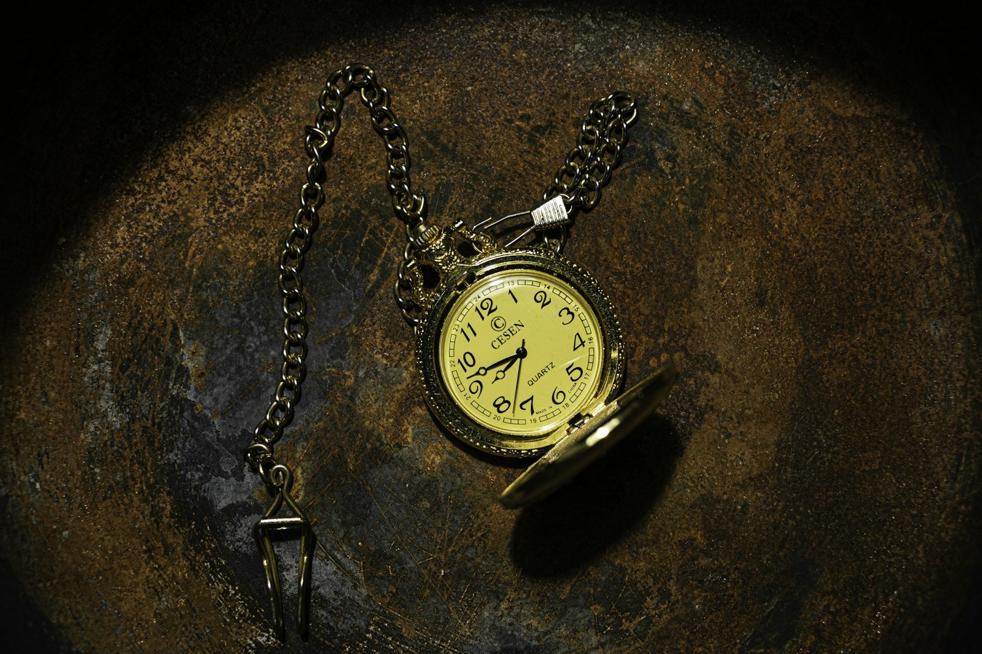 Gold-tone pocket watch and chain