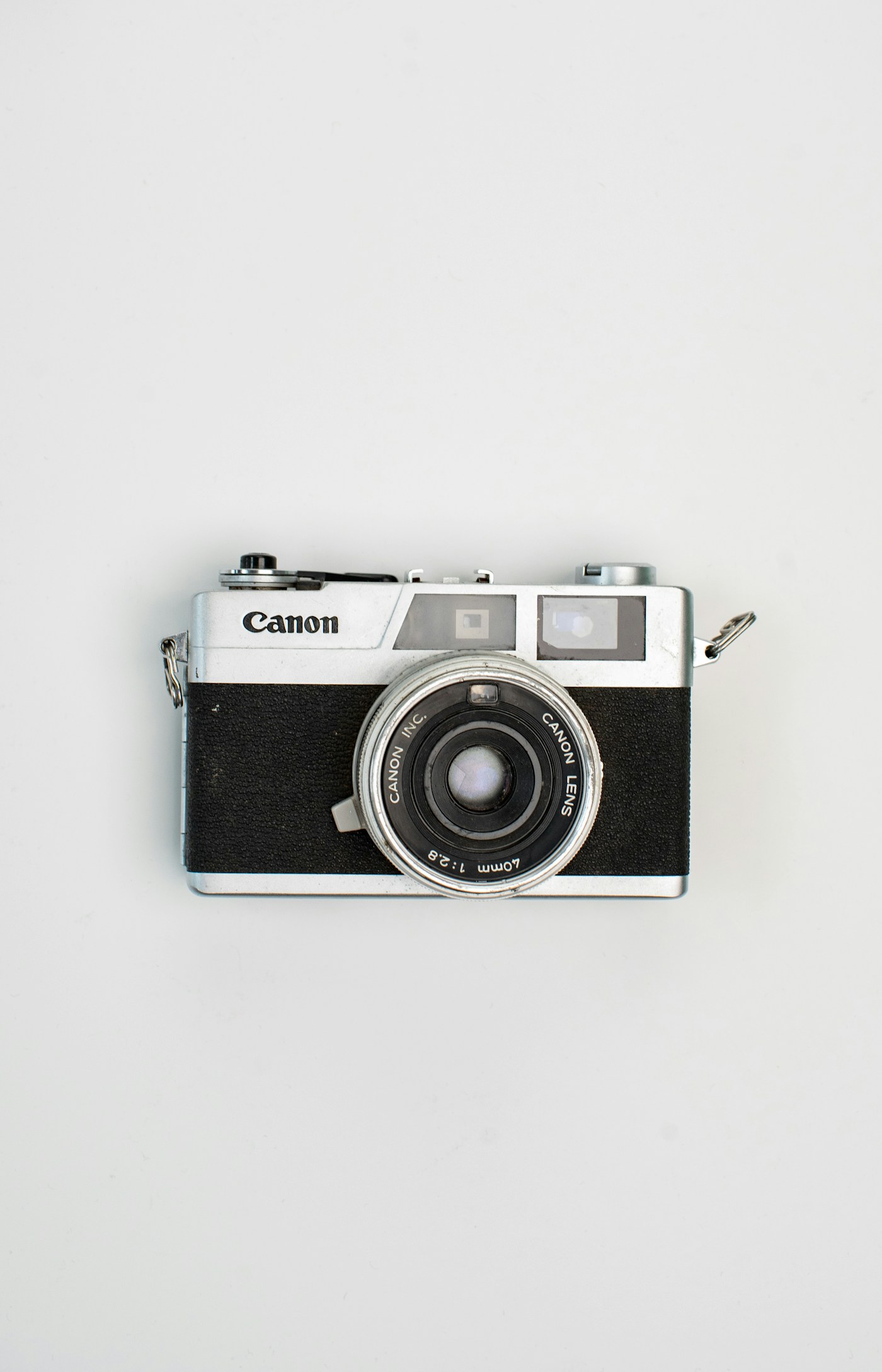 Silver and black rangefinder camera
